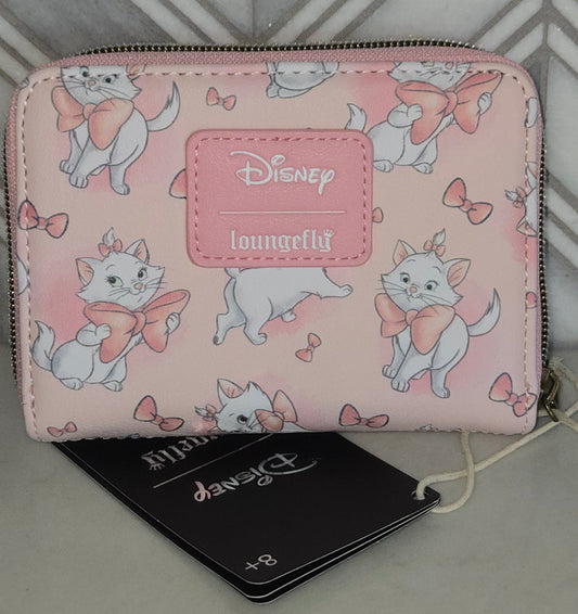 Pink wallet with cartoon character design on a gray and white patterned surface