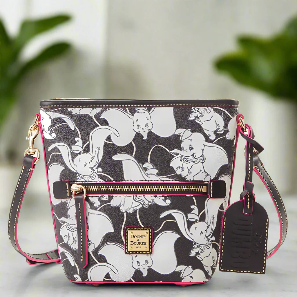 Crossbody bag with Dumbo the Elephant pattern on a white background