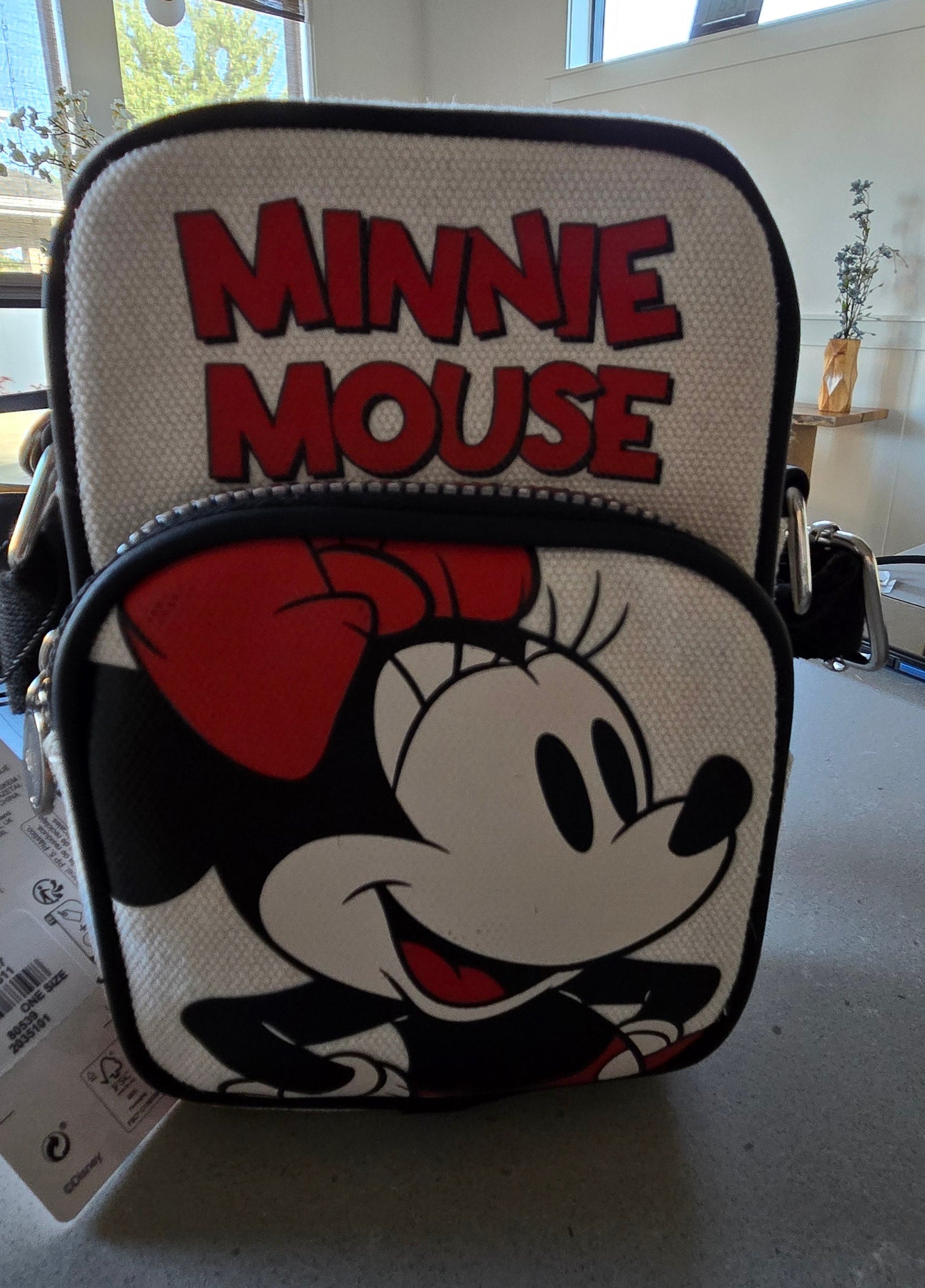 Minnie Mouse pouch with red heart on a gray surface