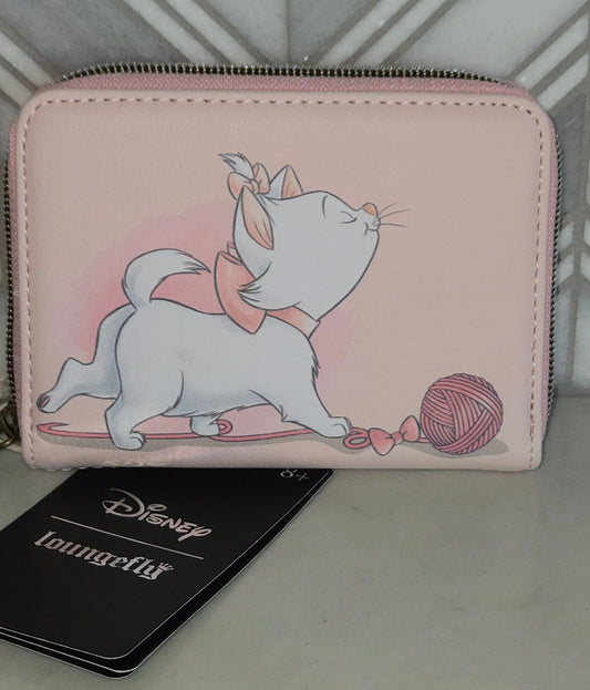 Pink wallet with cartoon character design on a gray surface
