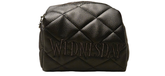 Black quilted bag with 'WEDNESDAY' branding on a surface.