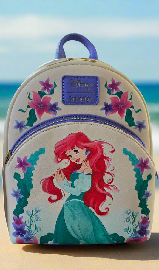 Children's backpack with a mermaid design on a kitchen counter